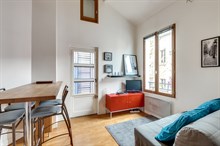 Monthly furnished rental one bedroom for two in front of the Buttes Chaumont Paris nineteenth district 19th arrondissement