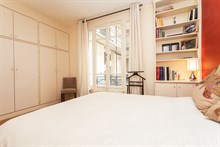 Enjoy a short-term apartment stay for 4 with 2 fully furnished rooms and a mini-library in the Swiss Village, Paris 15th