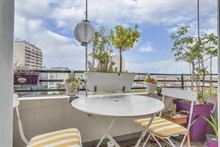 Seasonal furnished rental large studio alcove for two with balcony + view around corner from metro in Vanves