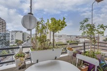 Seasonal furnished rental large studio alcove for two with balcony + view around corner from metro in Vanves