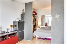 Seasonal furnished rental large studio alcove for two with balcony + view around corner from metro in Vanves