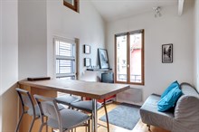 Monthly furnished rental one bedroom for two in front of the Buttes Chaumont Paris nineteenth district 19th arrondissement