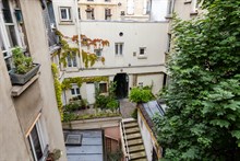 Elegante monolocale di 18 m2, per 1 o 2 persone, in stile moderno e raffinato nel quartiere des Abbesses, vicino Montmartre, 18° distretto di Parigi.